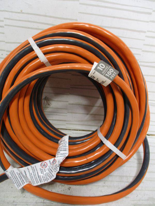 RIDGID 100 ft. 10/3 Heavy Duty Indoor/Outdoor SJTW Extension Cord with  Lighted End, Orange/Grey (Retail Price $ 179) Auction